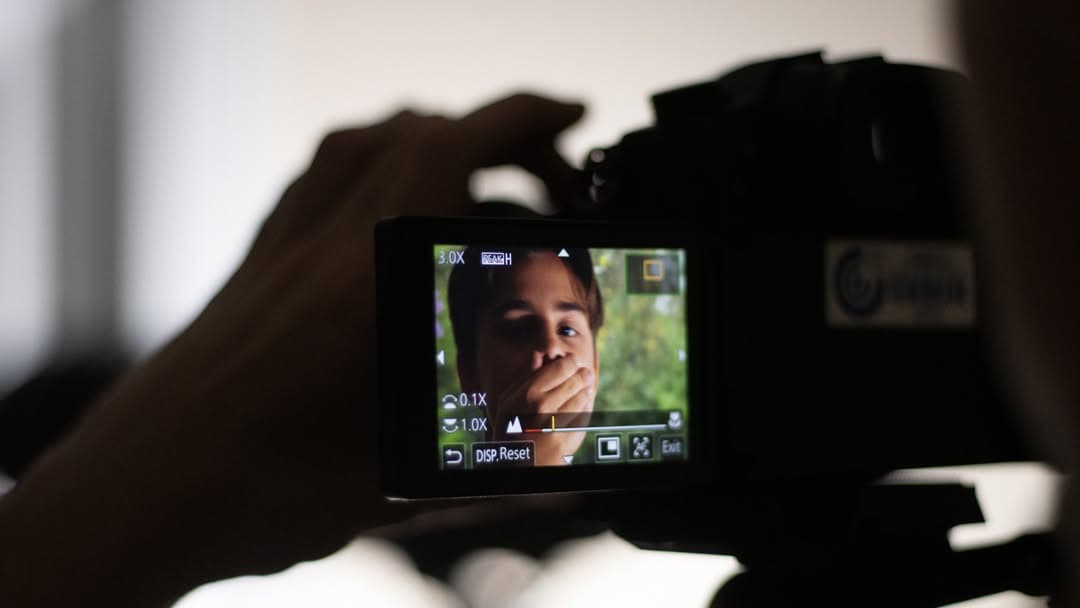 Young filmmaker directing scene