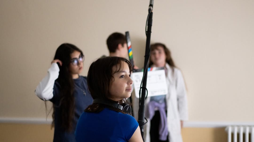 Film instructor with students